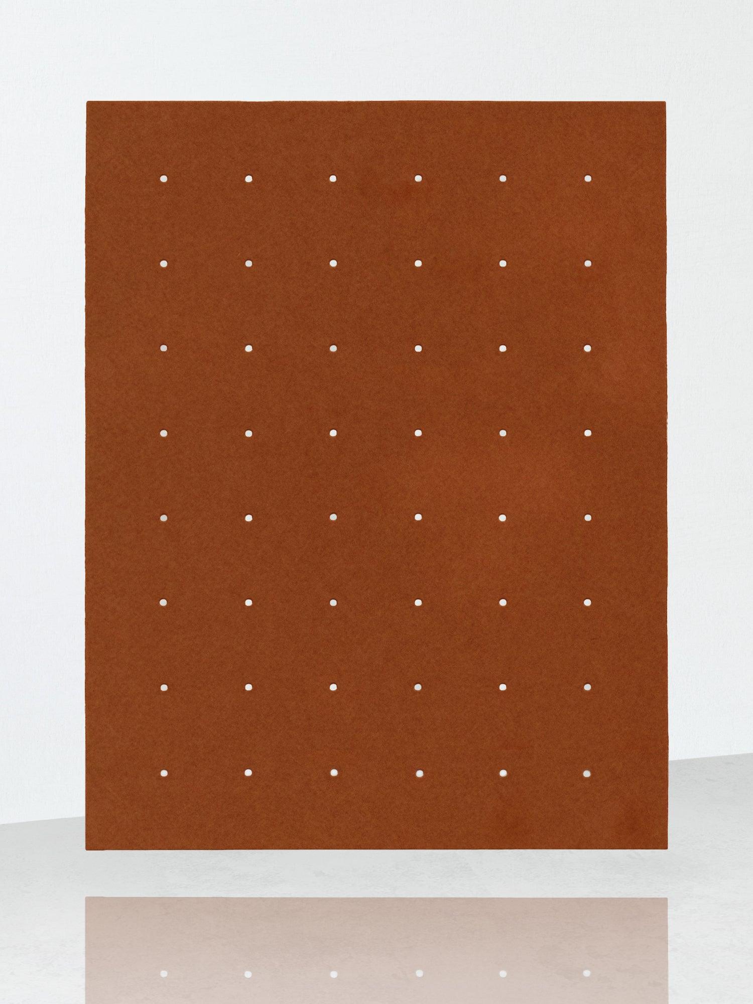 https://biritestudio.com/cdn/shop/products/perforated-rug-small-hole-rust-bi-rite-studio-4.jpg?v=1667501733